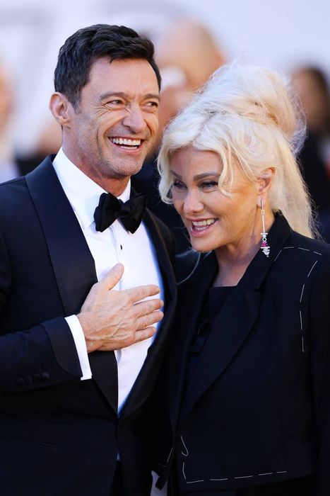 Hugh Jackman and Deborra-Lee Furness sharing a smile at a formal event.