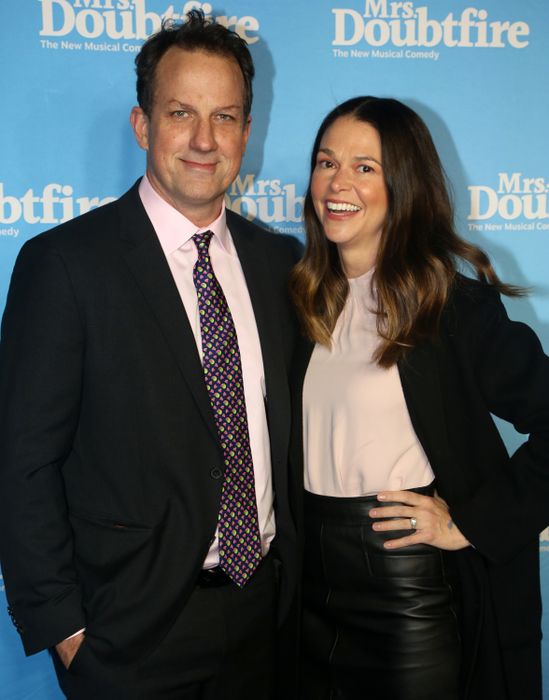 Ted Griffin and Sutton Foster enjoying themselves at an event.