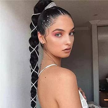 A model showcasing the hair chain clipped into a braid.