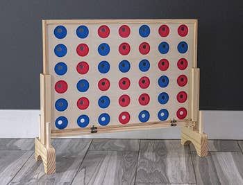 The oversized wooden connect four game set, perfect for epic play.