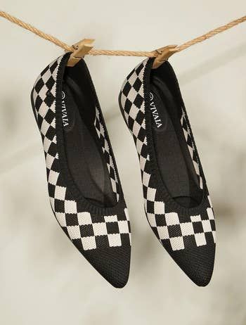a pair of knit pointed-toe flats with a black-and-white checkerboard pattern
