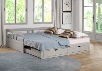 A trundle bed with storage drawers that can convert into a single king-sized bed.