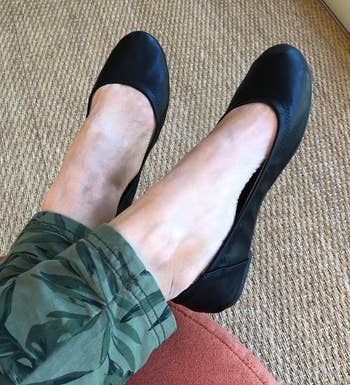 reviewer wearing the black flats