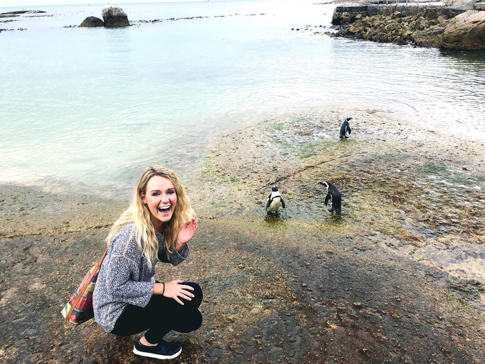 reviewer showcasing the black shoes outdoors