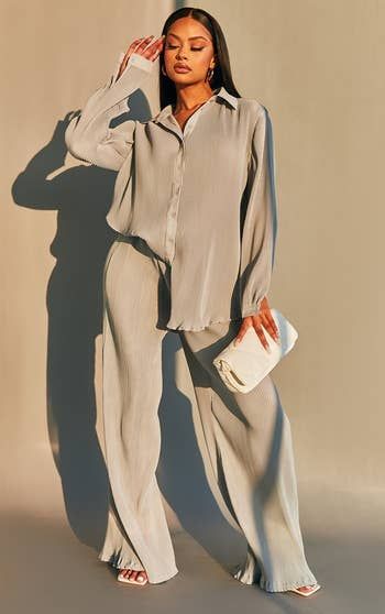 Another model rocking the gray outfit with style.