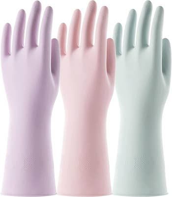 A set of three pastel-colored rubber gloves.