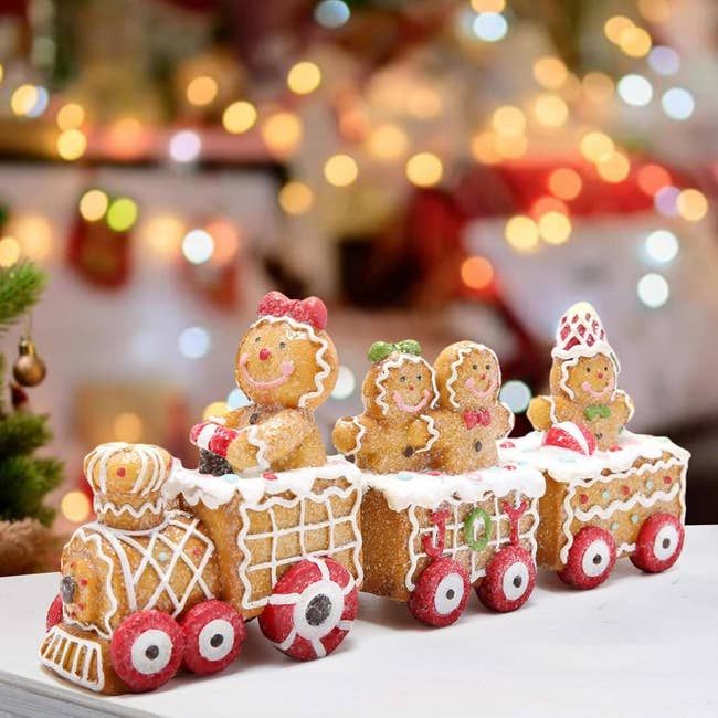 A festive gingerbread train with smiling cookie characters
