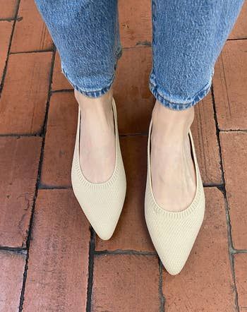 editor wearing the tan-colored flats