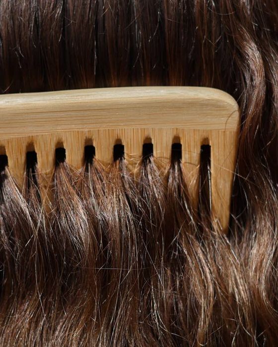 Comb running through hair