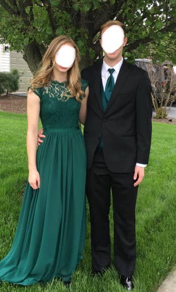reviewer wearing a green dress with date