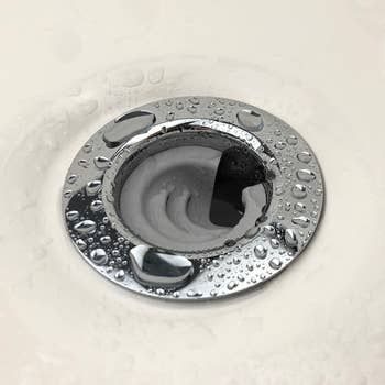 A close-up view of a sink drain with the DrainFunnel in position.