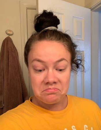 A reviewer showcasing flyaways in their hair