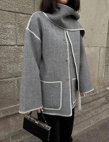 model wearing the gray coat