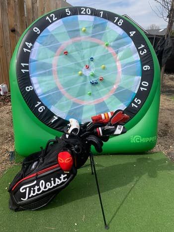 A golf target game featuring an inflatable dartboard and golf ball darts for a unique twist on your traditional golfing practice.