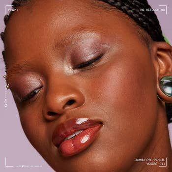 A model showcasing the eyeliner pencil application.