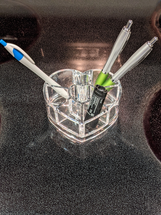 The organizer filled with pens and lip balm