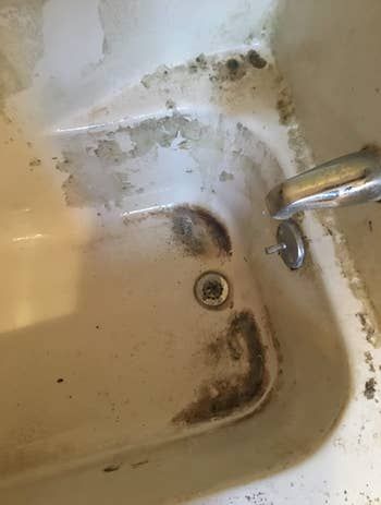 Reviewer's image of a grimy bathtub