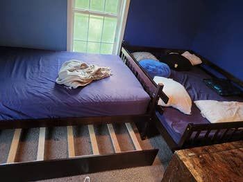 A photo from a reviewer showing a bunk bed that has been disassembled into two individual twin beds.