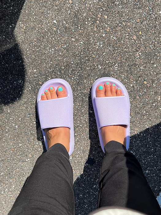 reviewer wearing purple slides