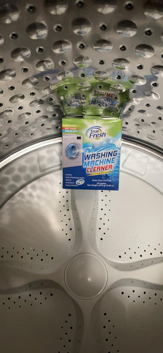reviewer photo showing a package of True Fresh cleaning tablets inside the washer