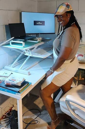 a reviewer standing at their workspace