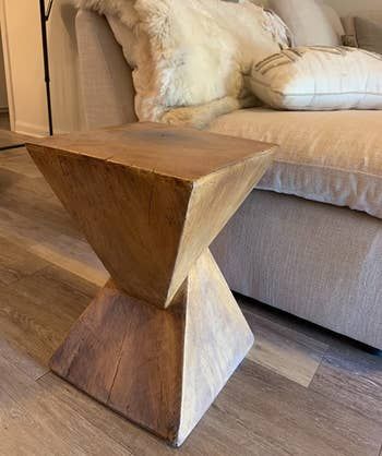 Close-up of the end table placed next to an armchair.