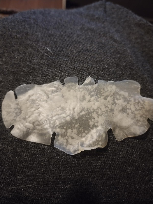 A photo of a used nose strip with impurities on it