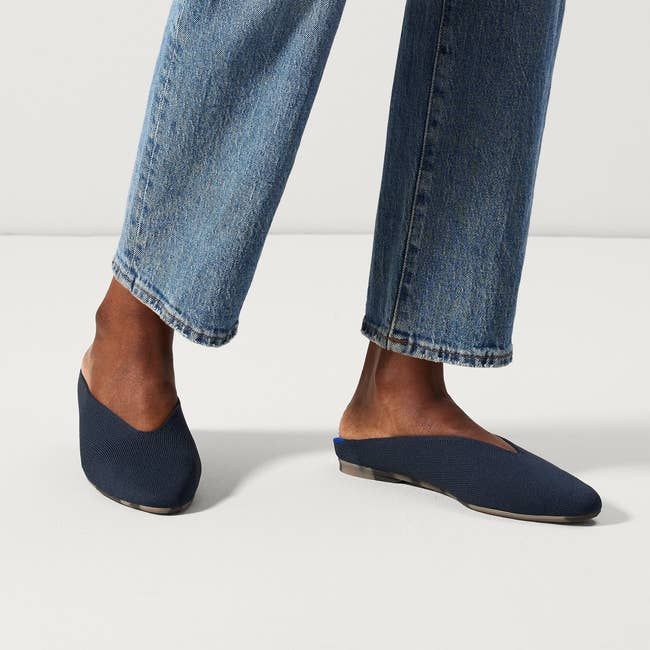 A model wears almond-shaped mules.