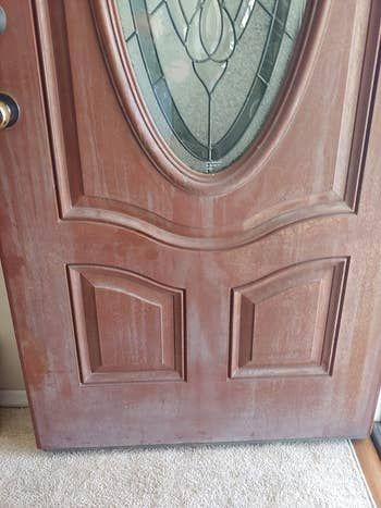 Before photo of a reviewer's reddish-brown door that looks dull and dirty.