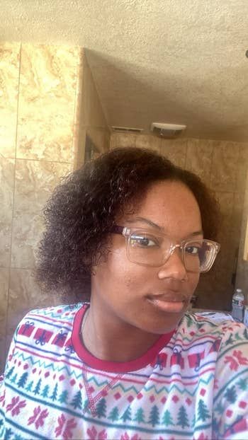 A reviewer showcasing their curly hair transformation
