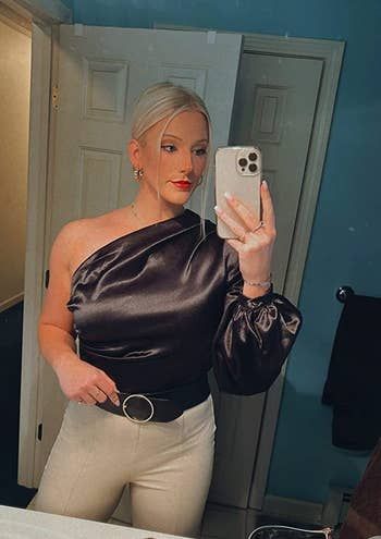 another reviewer styled in the black top paired with white pants