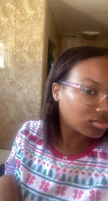 The same reviewer now showcasing their hair straightened effortlessly using the brush