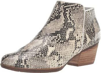 Ankle boot featuring a snakeskin pattern and a subtle heel