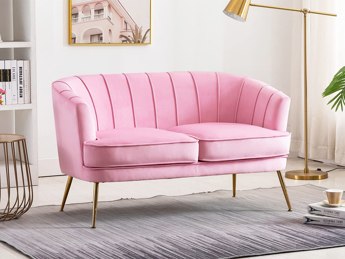 pink tufted loveseat with metallic gold legs