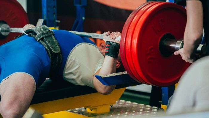 Is arching your back during a bench press deemed as cheating?