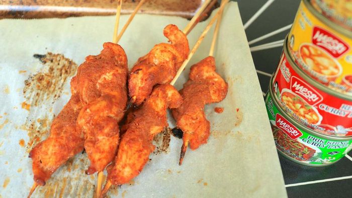 Chicken skewers soaked in a flavorful Thai curry paste marinade.