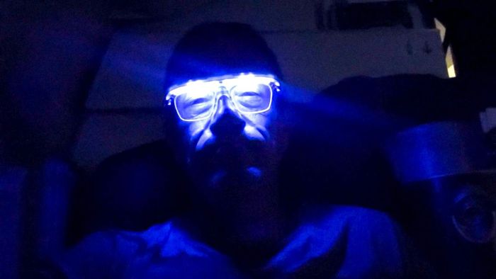 Richard Quest shows off his anti-jetlag glasses.