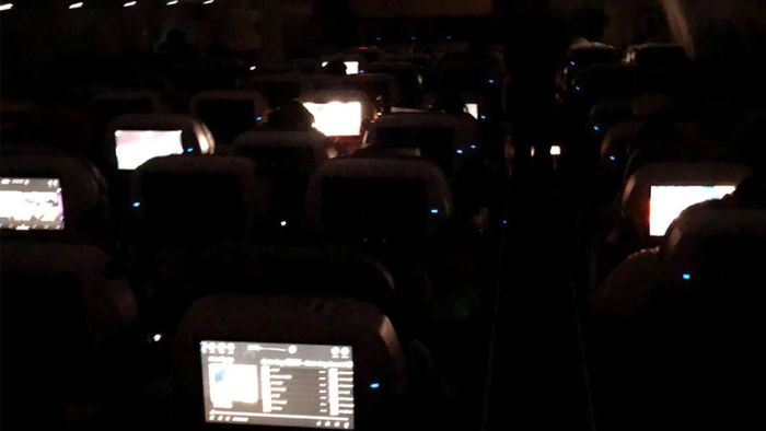 The plane is shrouded in complete darkness.
