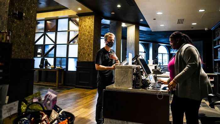 A tourist checks into a hotel in Savannah, Georgia, on April 25, 2020, shortly after Georgia Governor Brian Kemp lifted certain social distancing restrictions.
