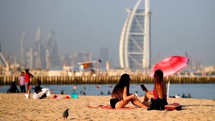 Dubai beachgoers captured in July 2020.