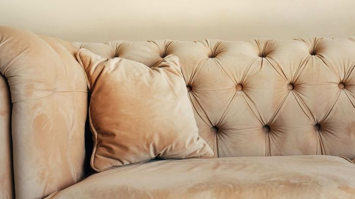 A light beige suede sofa.
