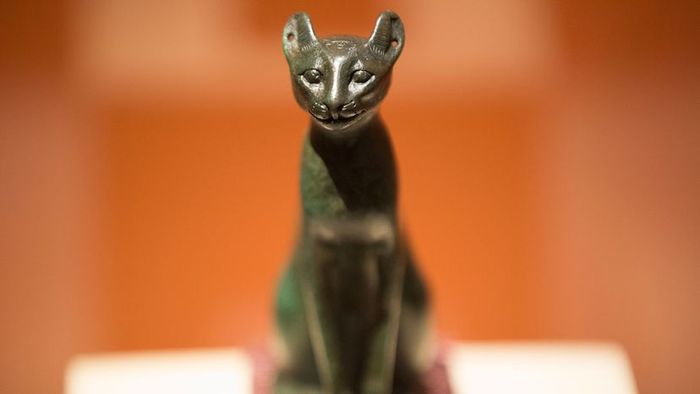 A bronze figure of a cat.