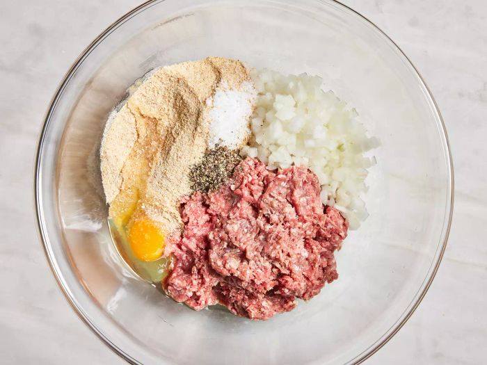 A top-down view of the meatball ingredients in a bowl, ready to be combined.