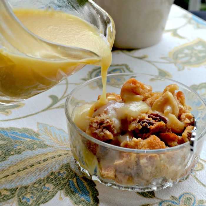 A serving of Gramma's Apple Bread Pudding in a glass bowl.