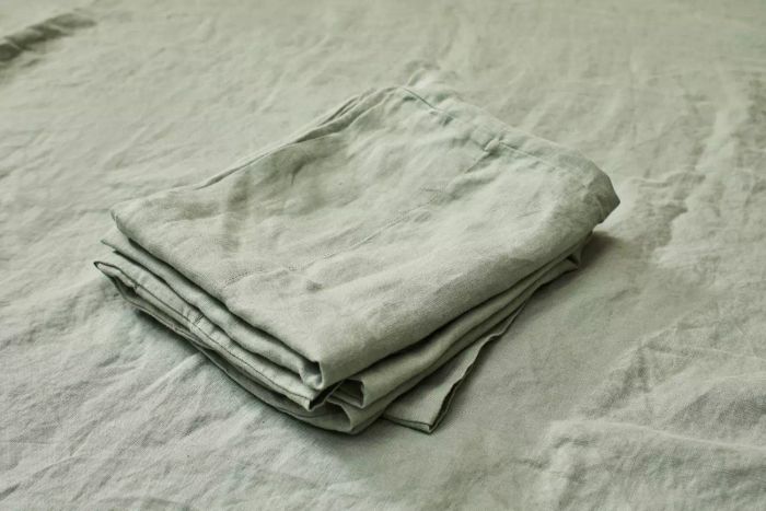 Casaluna 100% Washed Hemp Solid Sheet Set neatly folded in a pile.
