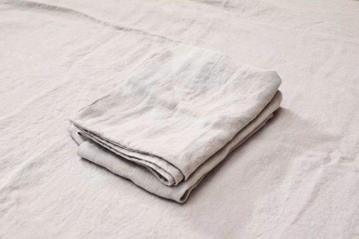 The Delilah Home Hemp Sheet Set folded and stacked in a neat pile.