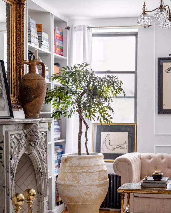 A large, statement vessel placed on the mantel.