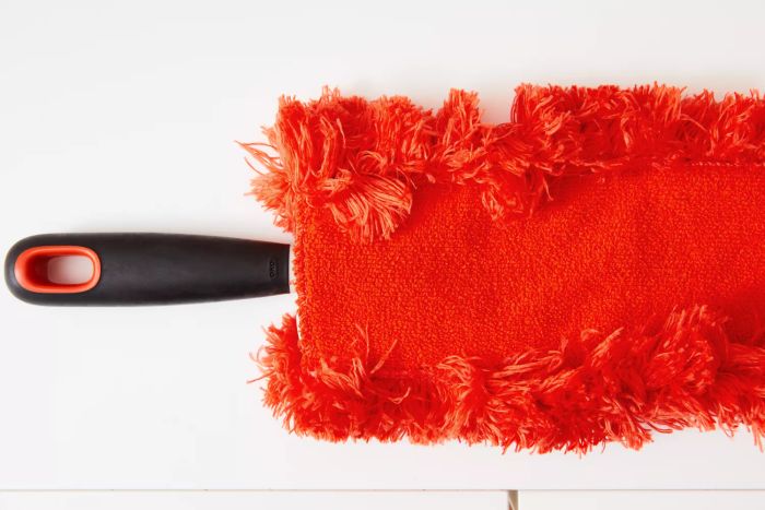 The handle of the OXO Good Grips Under-Appliance Microfiber Duster.