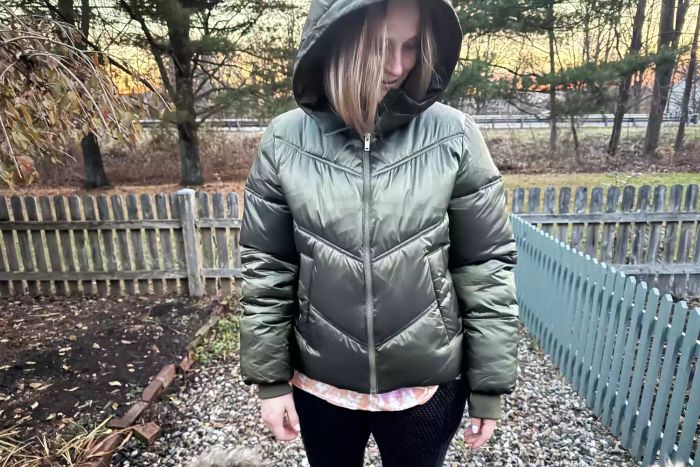 A woman wearing the Ugg Ronney Cropped Puffer Jacket