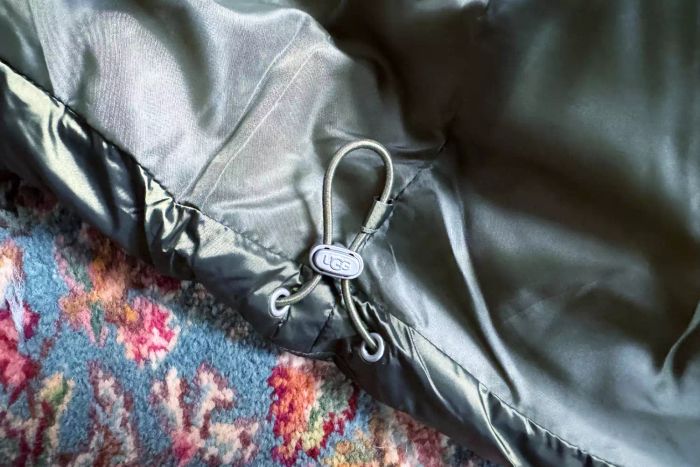 Close-up of the hood adjustment on the Ugg Ronney Cropped Puffer Jacket